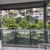 Retractable clothesline system with lines tensioned and pulled out to hang laundry.