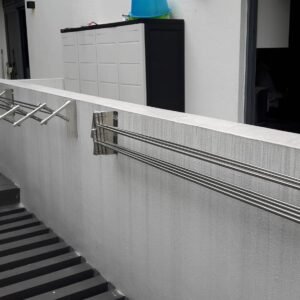 2 Ez CLC wall rack outdoors: one in open mode and the other in closed position. Stainless Steel. Heavy-duty.