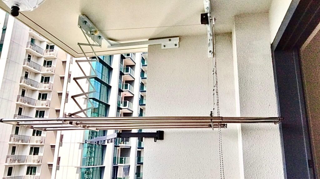 Ez Lift Extendable mounted on a short wall of a balcony space using custom bracketing.
