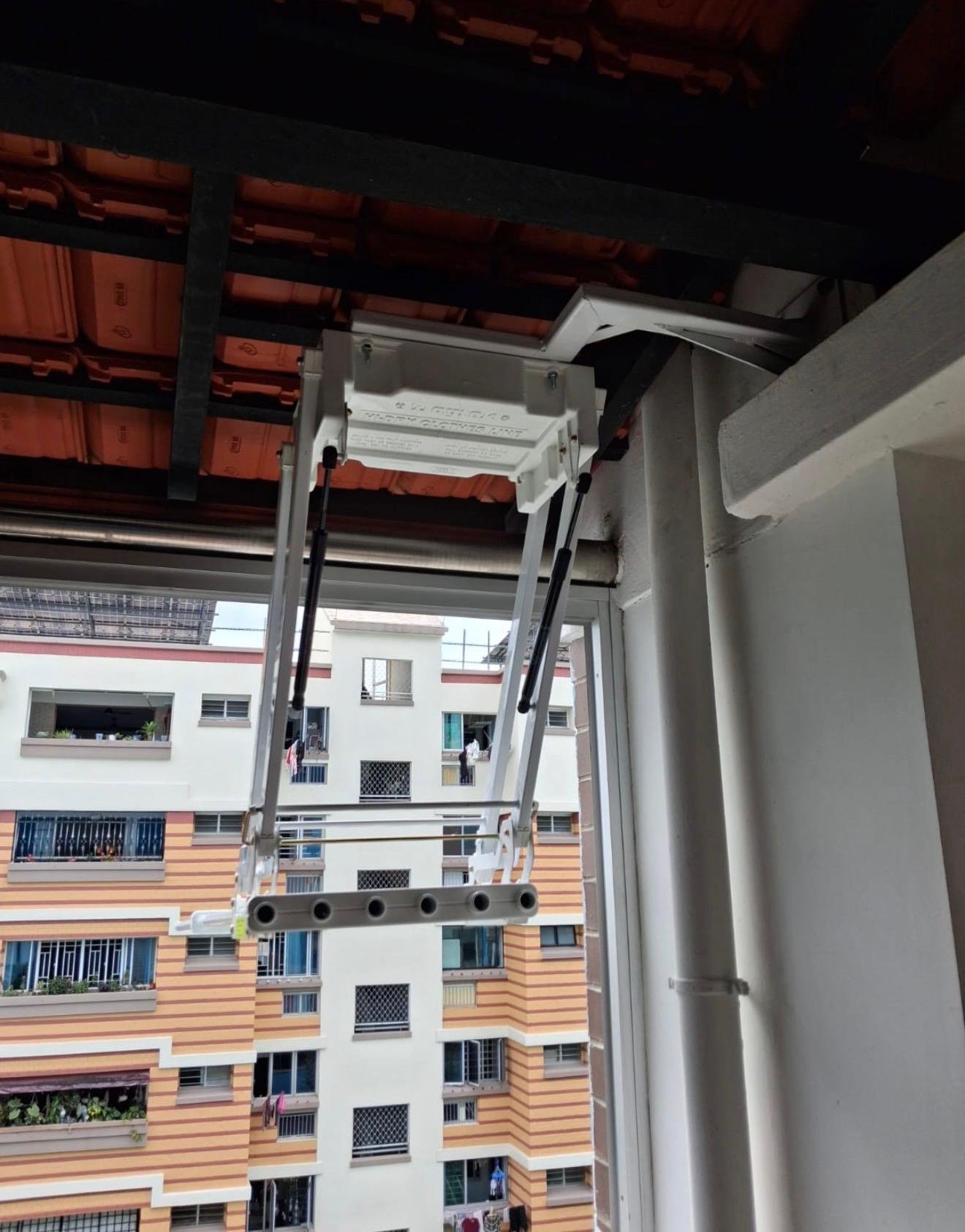 Custom wall bracket to overcome the pipe so that the Ez Hi-Dry can dry laundry out of the window of this maisonette.